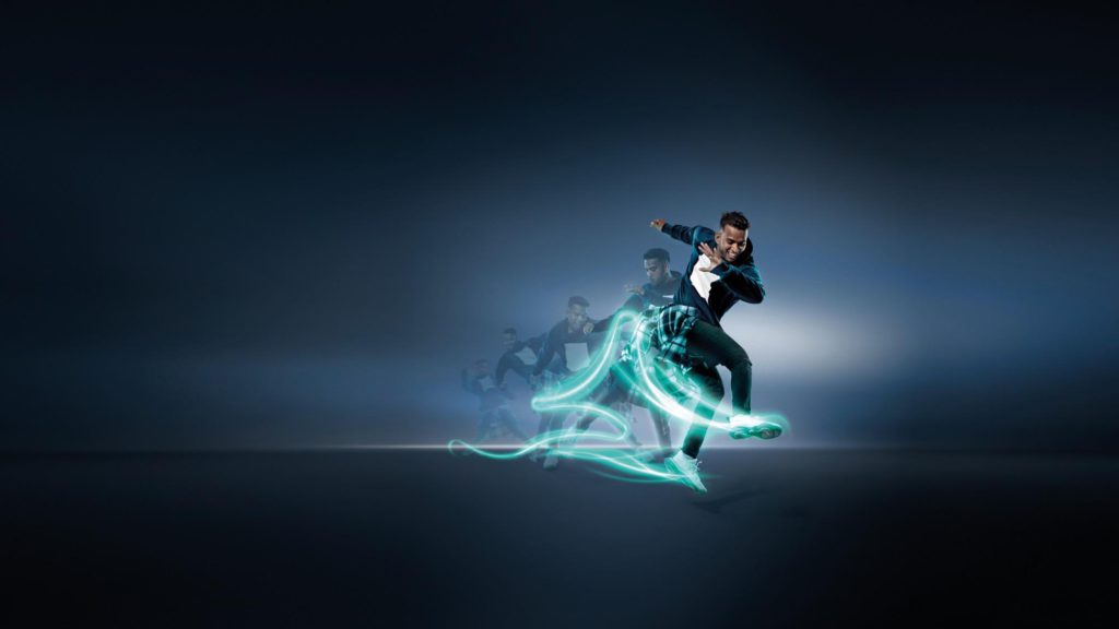 man dancing with sneakers emitting a light trail for a commercial