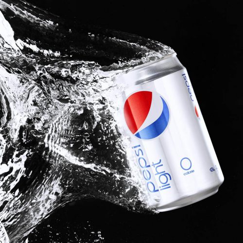 A Can of Pepsi Light dropped in water